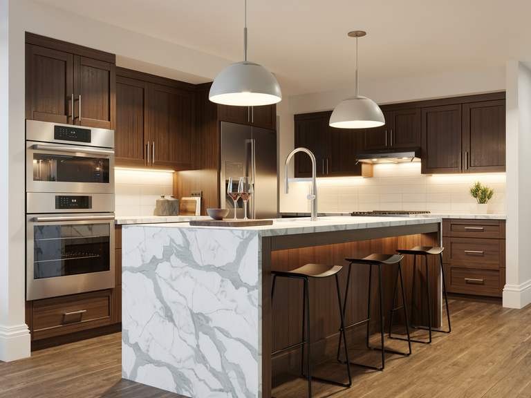 Kitchen with walnut shaker cabinets, double wall oven and marble waterfall island, designed in DesignFiles